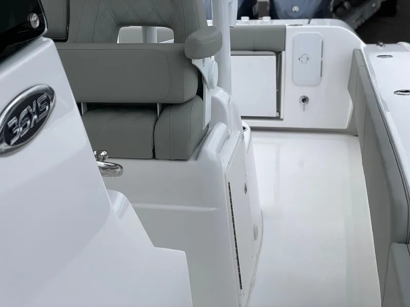 Slide: The Image of 2024 Cape Horn 36 XS boat interior with grey seating and white deck. - 15