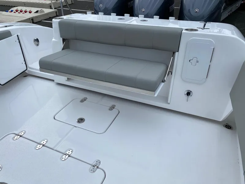 Slide: The Image of 2024 Cape Horn 36 XS boat interior with fold-down seating and storage compartments. - 17