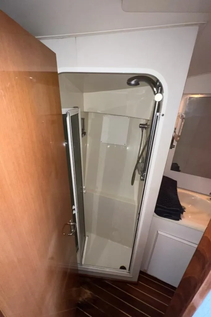 Slide: The Image of 2000 Viking 50 Express yacht bathroom with shower and sink. - 15
