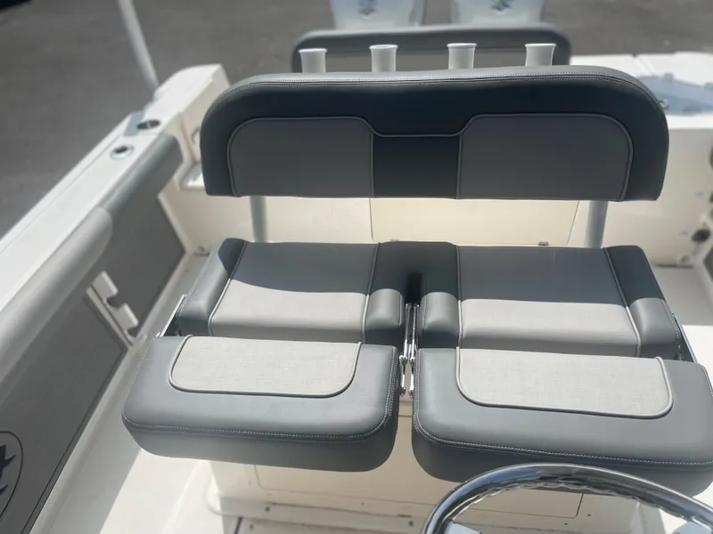 Slide: The Image of 2024 Sea Born LX 24 boat seating and console area. - 11