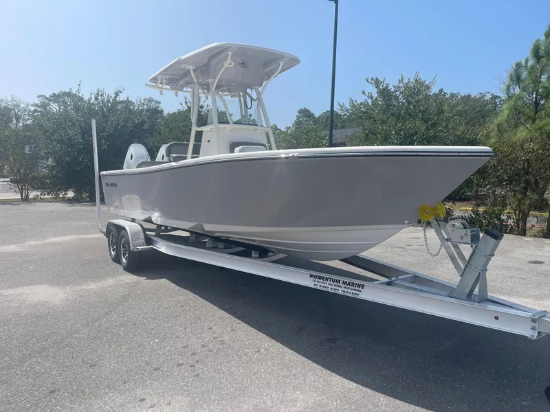 Slide: The Image of 2024 Sea Born LX 24 boat on a trailer in a parking lot. - 3