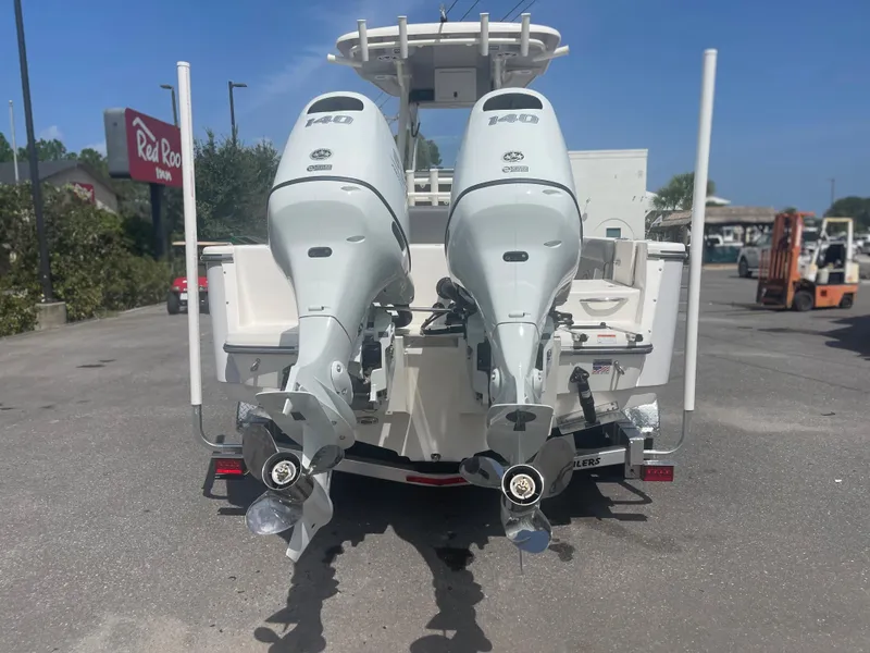 Slide: The Image of 2024 Sea Born LX 24 boat with twin outboard engines, rear view. - 4