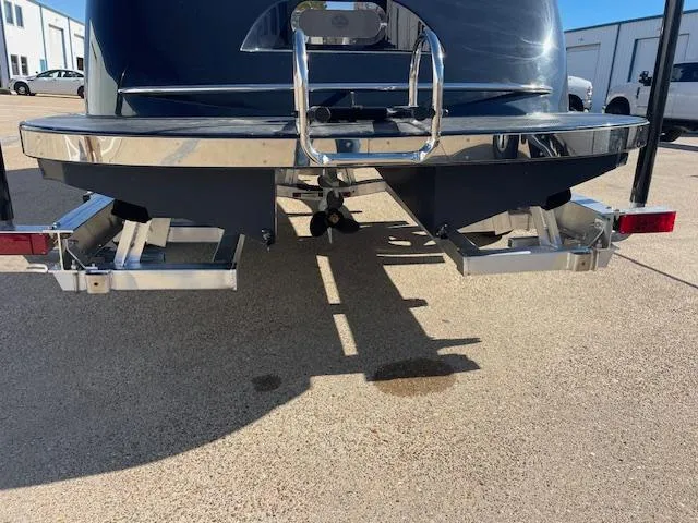 Slide: The Image of Rear view of a 2023 Maxima 620 Retro boat on a trailer. - 2