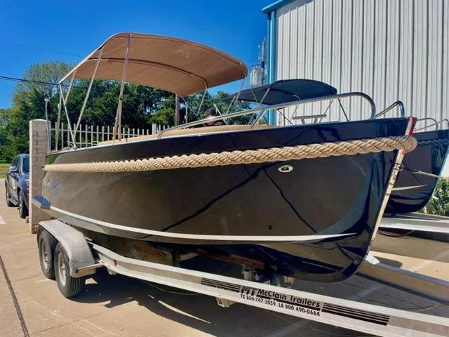 Slide: The Image of 2023 Maxima 620 Retro boat on trailer with canopy in outdoor setting. - 3