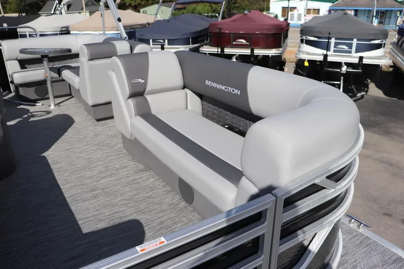Slide: The Image of 2024 Bennington 20 SL pontoon boat with gray seating and sleek design. - 4