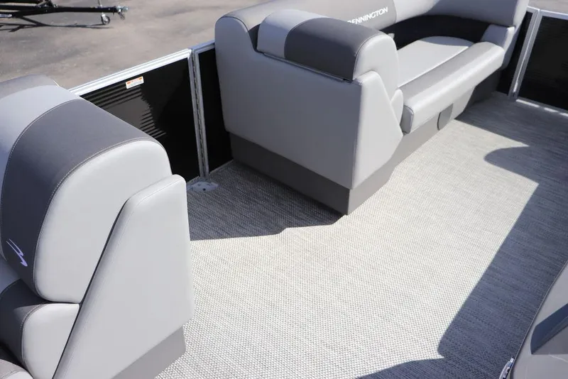 Slide: The Image of 2024 Bennington 20 SL pontoon boat interior with gray seating and flooring. - 5