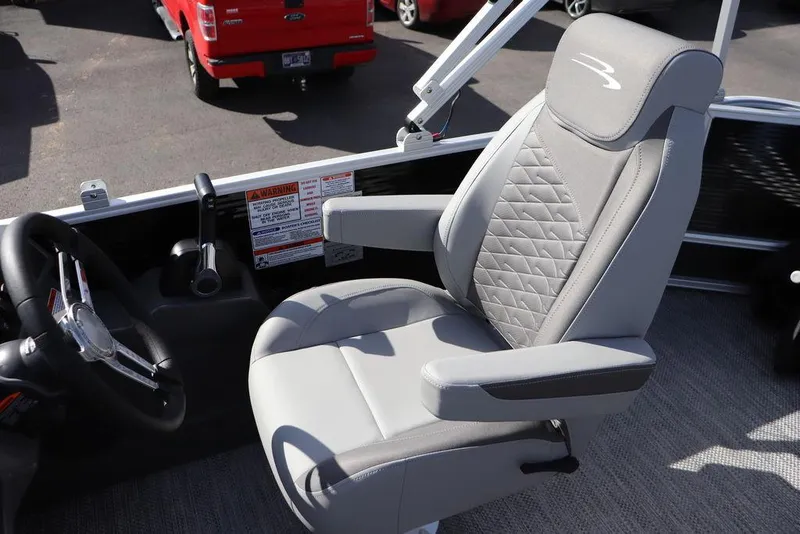 Slide: The Image of 2024 Bennington 20 SL boat captain's chair with sleek design and comfortable seating. - 6