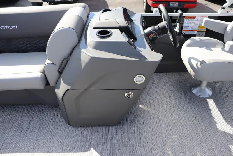Slide: The Image of 2024 Bennington 20 SL boat interior with gray seating and steering console. - 8