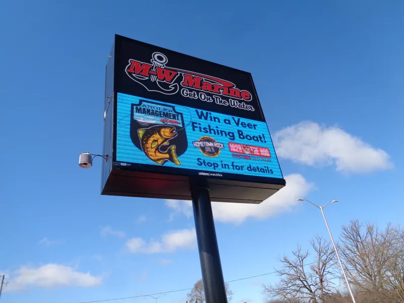 Slide: The Image of M-W Marine sign promoting a contest to win a 2024 Lund 1600 Fury SS fishing boat. - 13