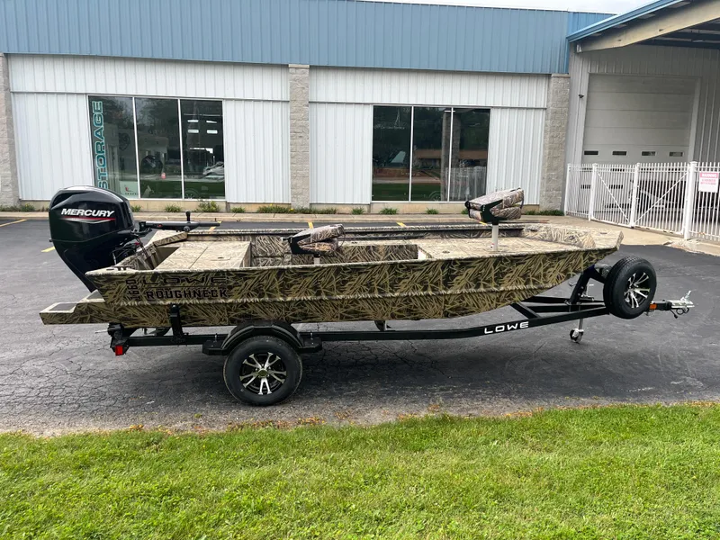 The Image of 2024 Lowe Roughneck 1660 boat on trailer with camouflage design and Mercury outboard motor. - 0