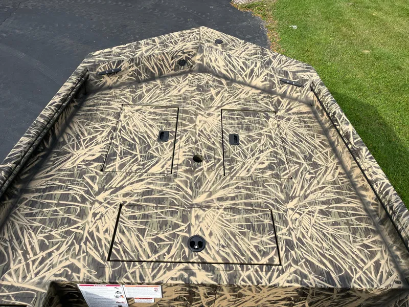 Slide: The Image of 2024 Lowe Roughneck 1660 boat with camouflage pattern on deck. - 8