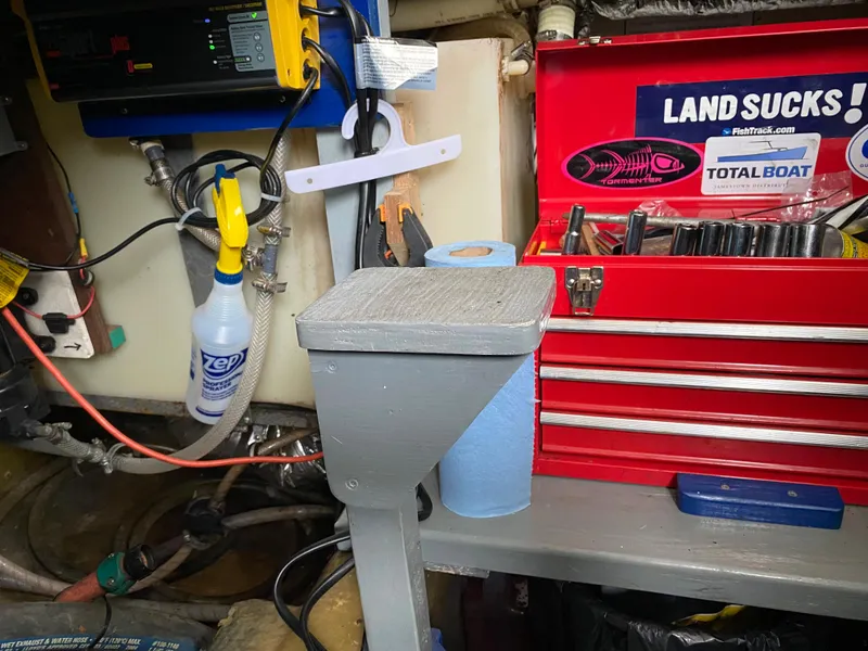 Slide: The Image of Workshop with red toolbox, cleaning supplies, and tools on a Jersey Dawn 40 boat, 1977 model. - 14