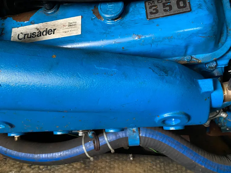 Slide: The Image of Close-up of a blue Crusader engine in a 1977 Jersey Dawn 40 boat. - 17