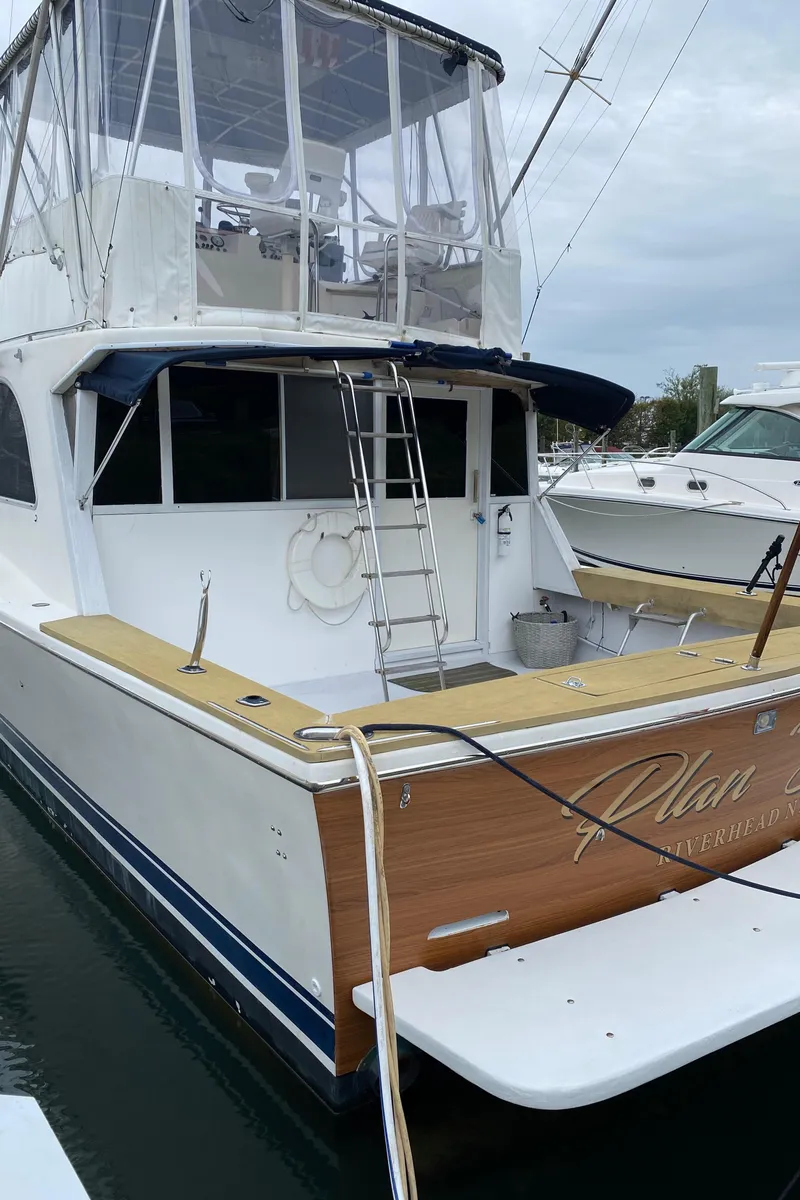 Slide: The Image of 1977 Jersey Dawn 40 yacht docked at marina, rear view. - 20