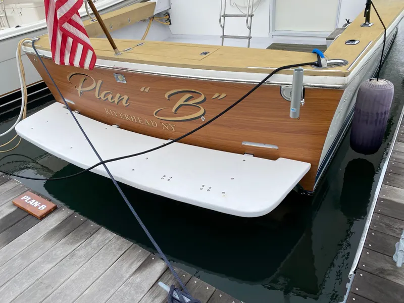Slide: The Image of 1977 Jersey Dawn 40 boat named Plan B docked at a marina. - 22