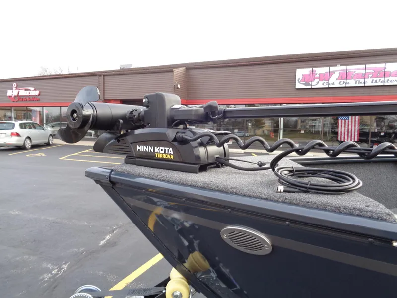 Slide: The Image of 2024 Lund 1650 Rebel XL Sport with Minn Kota Terrova trolling motor in parking lot. - 6