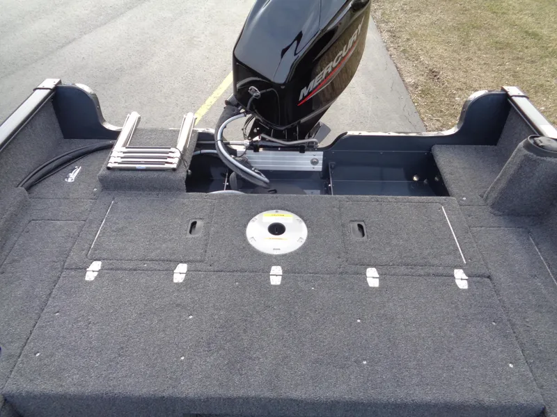 Slide: The Image of 2024 Lund 1650 Rebel XL Sport boat with Mercury outboard motor, rear deck view. - 9