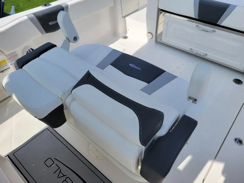 Slide: The Image of 2024 Robalo 250 CC boat seating and deck area. - 15