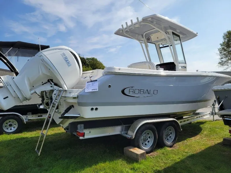 Slide: The Image of 2024 Robalo 250 CC boat on trailer with Yamaha outboard motor. - 4