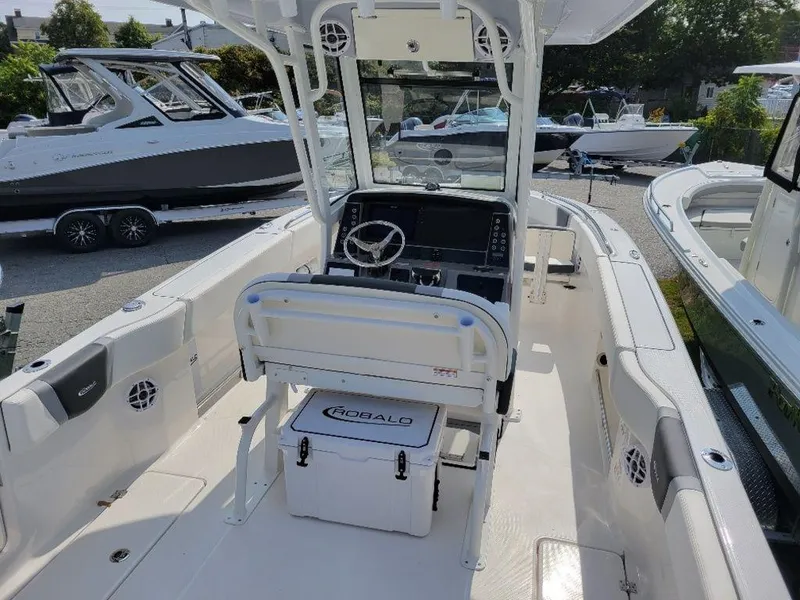 Slide: The Image of 2024 Robalo 250 CC center console boat interior with helm and seating. - 7
