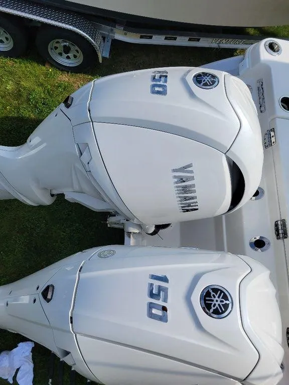 Slide: The Image of 2024 Robalo 250 CC with twin Yamaha 150 outboard engines. - 8