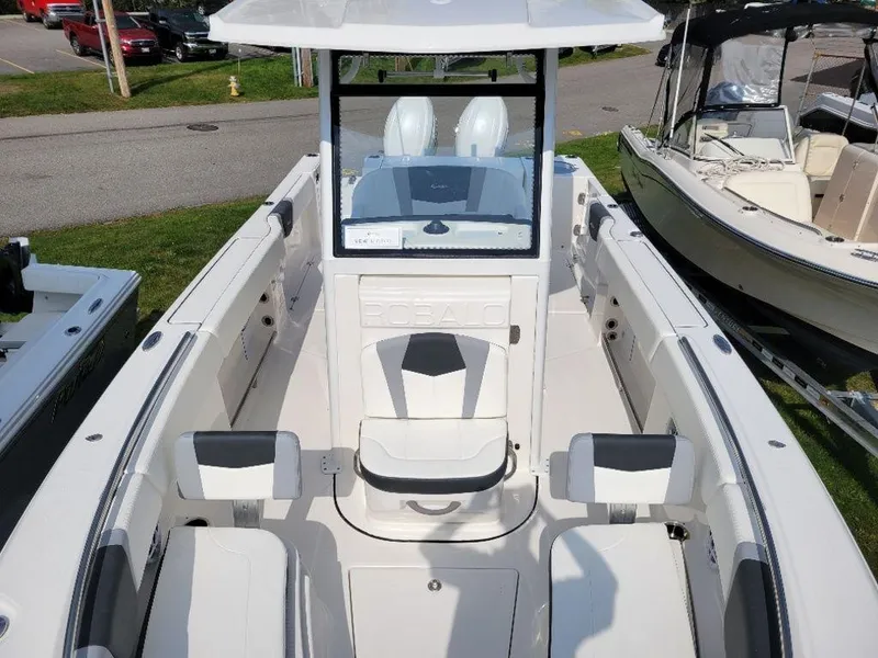 Slide: The Image of 2024 Robalo 250 CC center console boat with seating and storage compartments. - 9