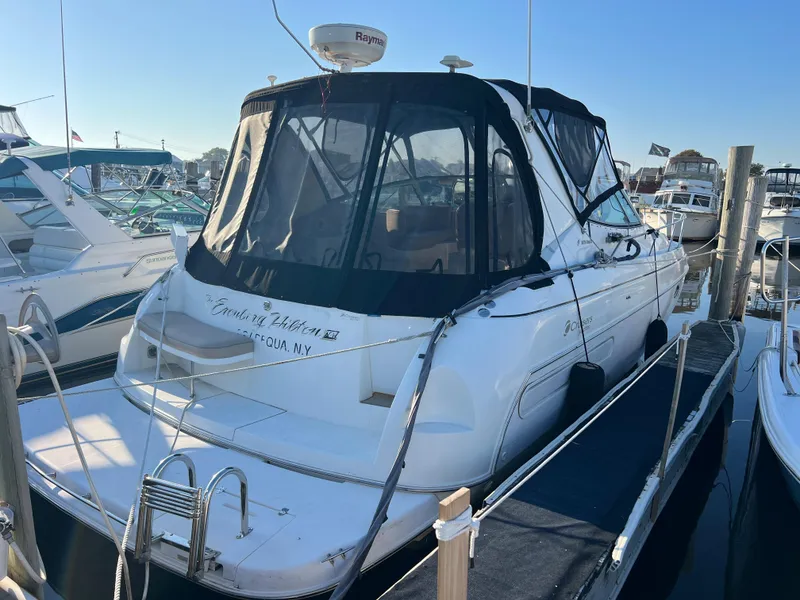 The Image of 1999 Cruisers Yachts 3575 Esprit docked at marina with black canvas cover. - 0