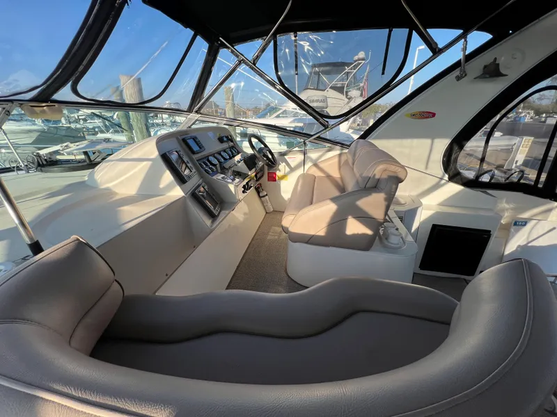 Slide: The Image of 1999 Cruisers Yachts 3575 Esprit cockpit with helm and seating area. - 12