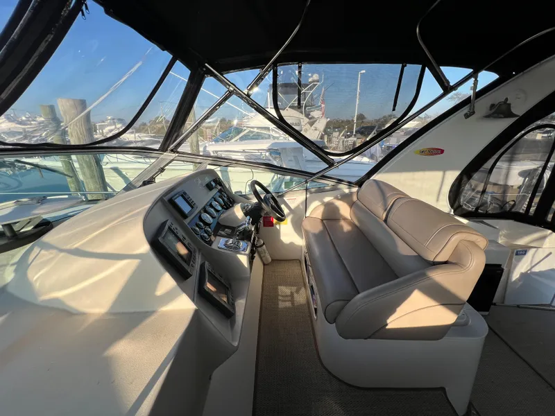 Slide: The Image of 1999 Cruisers Yachts 3575 Esprit cockpit with helm and seating area. - 16