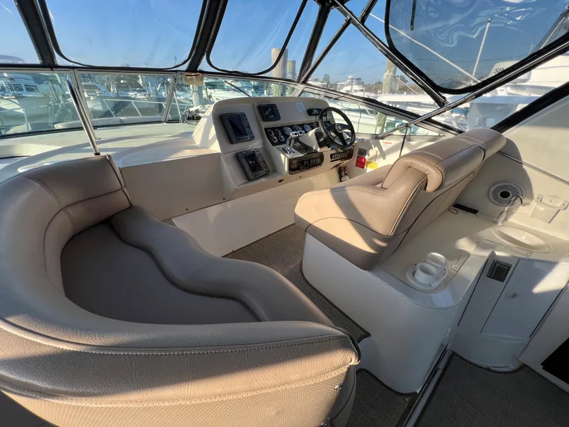 Slide: The Image of 1999 Cruisers Yachts 3575 Esprit cockpit with helm and seating area. - 18