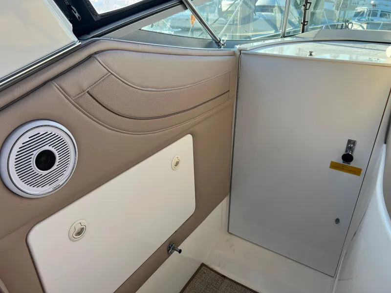 Slide: The Image of Interior view of 1999 Cruisers Yachts 3575 Esprit, featuring storage compartments and speaker. - 21
