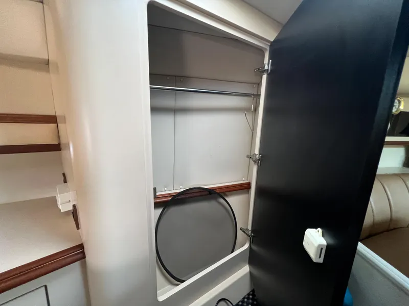 Slide: The Image of 1999 Cruisers Yachts 3575 Esprit interior closet with open door. - 22