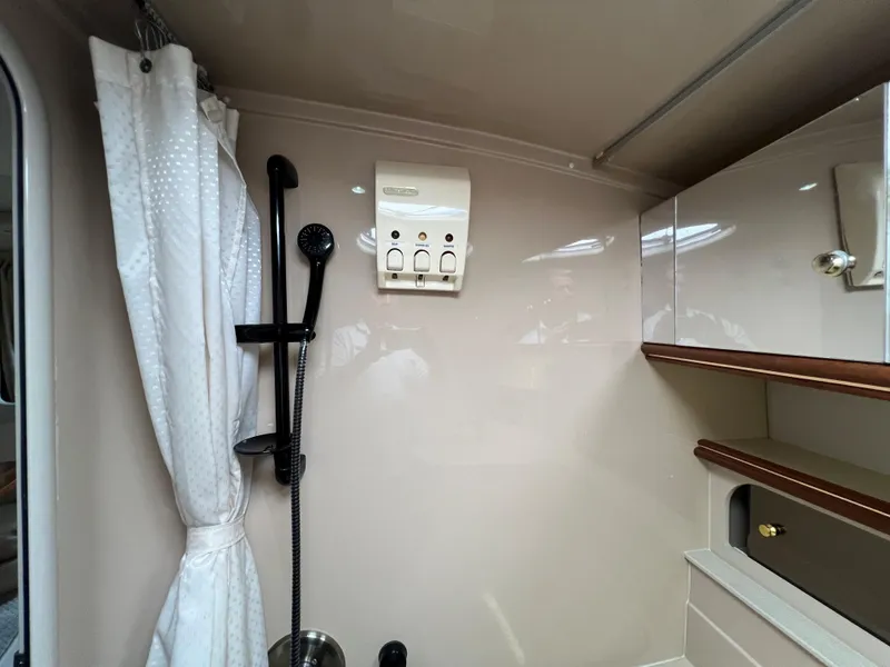 Slide: The Image of 1999 Cruisers Yachts 3575 Esprit bathroom with shower and storage cabinets. - 25