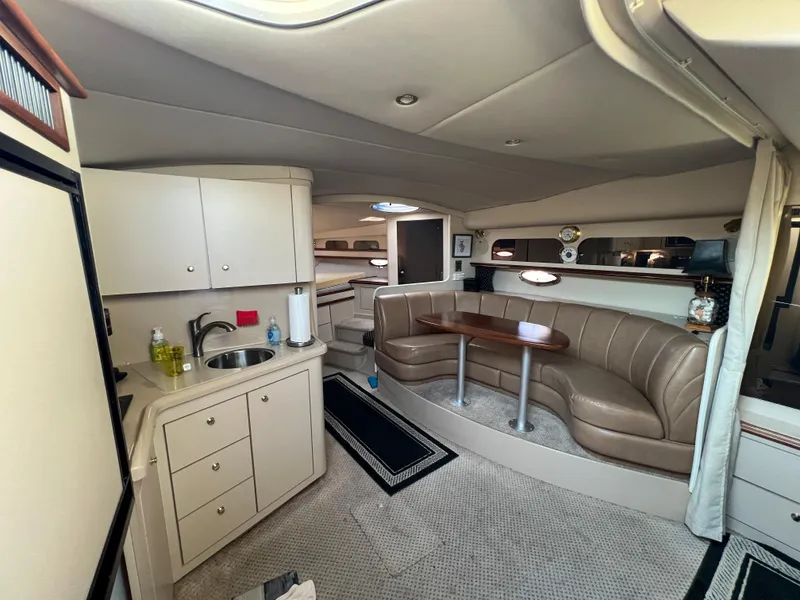 Slide: The Image of 1999 Cruisers Yachts 3575 Esprit interior with kitchenette and dining area. - 28