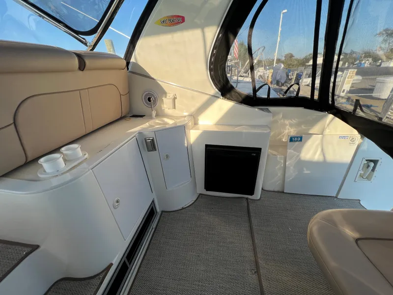 Slide: The Image of 1999 Cruisers Yachts 3575 Esprit interior with seating and storage compartments. - 33