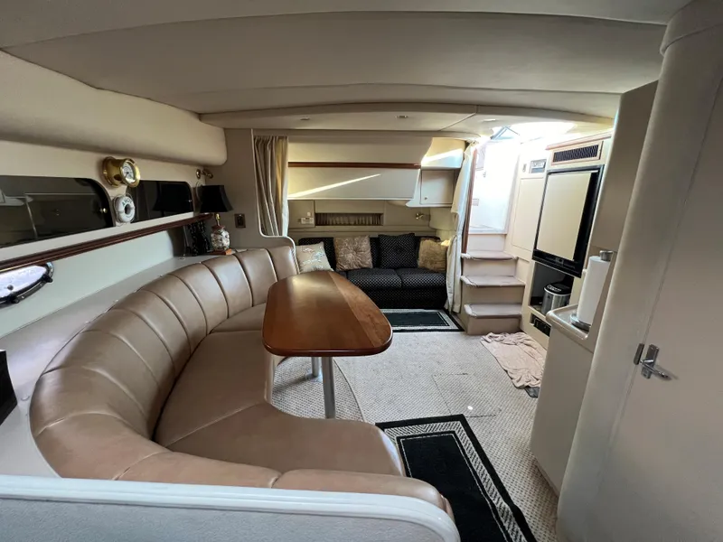 Slide: The Image of 1999 Cruisers Yachts 3575 Esprit interior with dining area and lounge. - 2