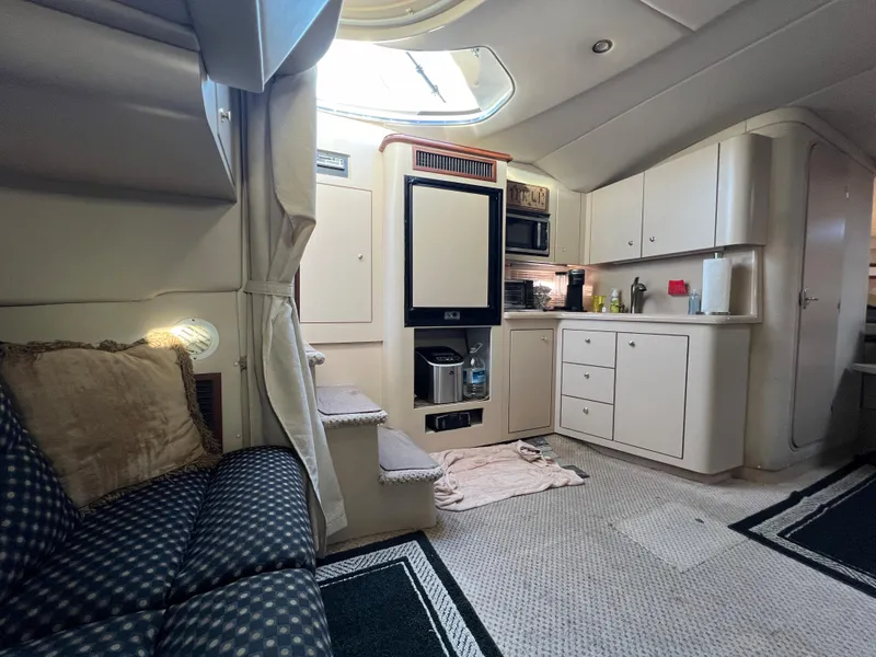 Slide: The Image of 1999 Cruisers Yachts 3575 Esprit interior with kitchen and seating area. - 27