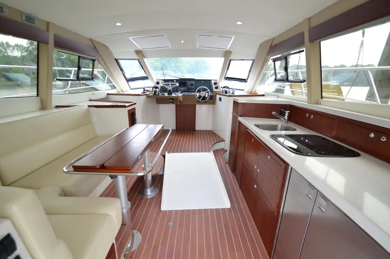Slide: The Image of Luxurious interior of 2022 ArrowCat 42 Coupe yacht with modern kitchen and seating area. - 5