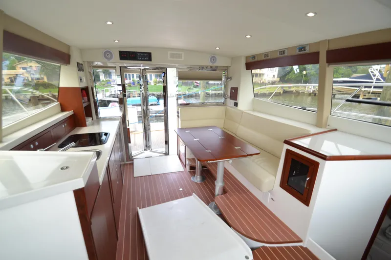 Slide: The Image of Interior of 2022 ArrowCat 42 Coupe, featuring modern kitchen and seating area. - 6