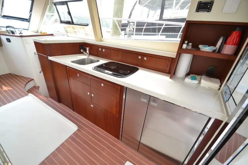 Slide: The Image of Modern kitchen interior of 2022 ArrowCat 42 Coupe yacht with sleek countertops and appliances. - 8