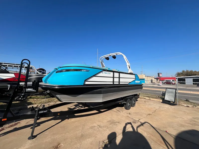 The Image of 2023 Montara Surf Boss 2.0 CWDH boat on trailer, vibrant blue exterior. - 1