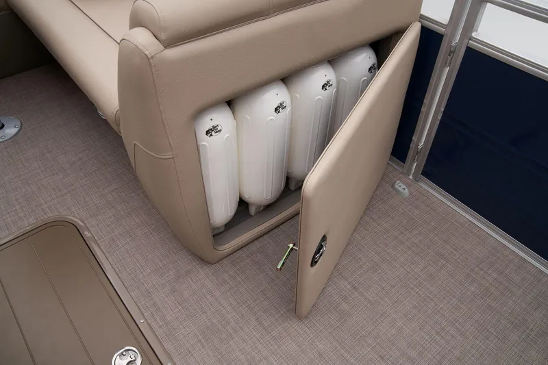 Slide: The Image of 2024 Sun Tracker Fishin' Barge 22 XP3 storage compartment with fenders. - 51