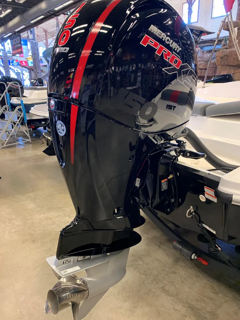 Slide: The Image of 2024 Tahoe T21 boat with Mercury Pro outboard motor in showroom. - 3