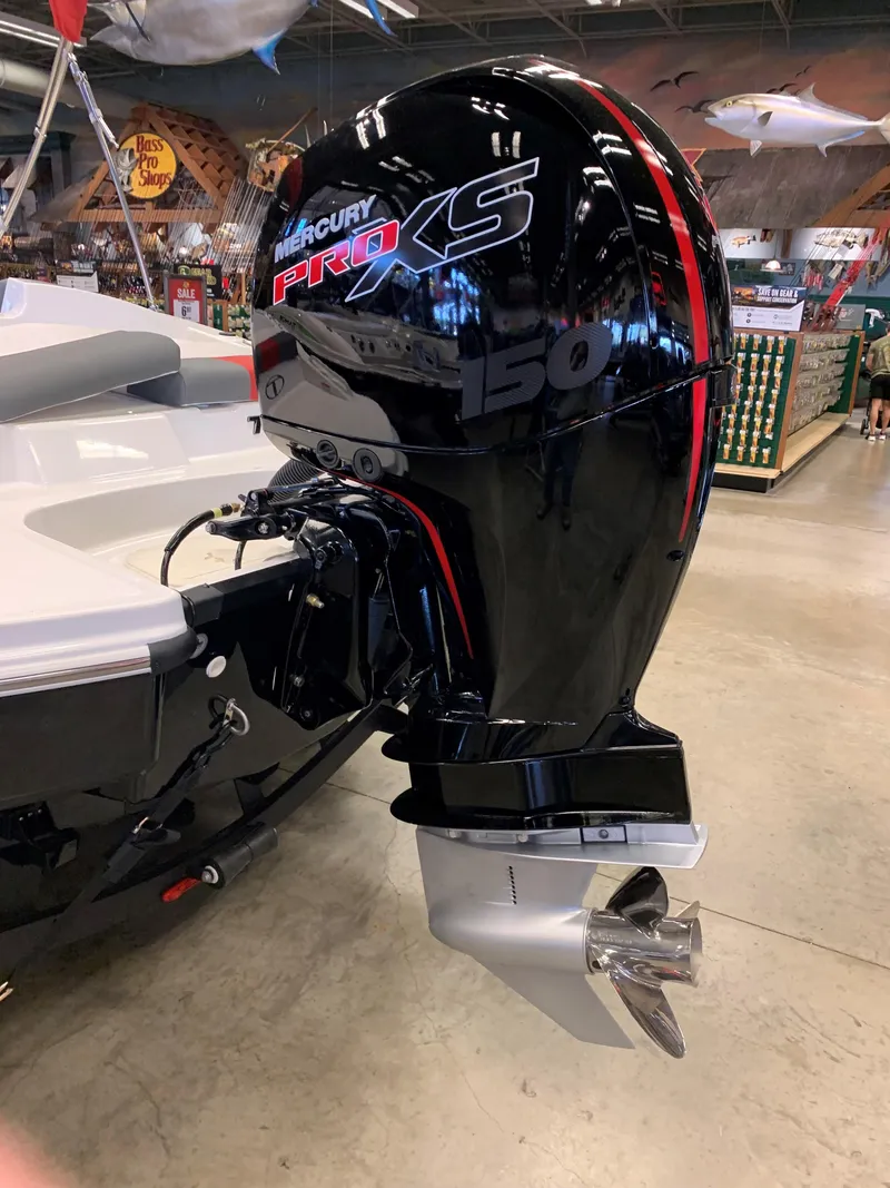 Slide: The Image of 2024 Tahoe T21 boat with Mercury Pro XS 150 outboard motor in showroom. - 4