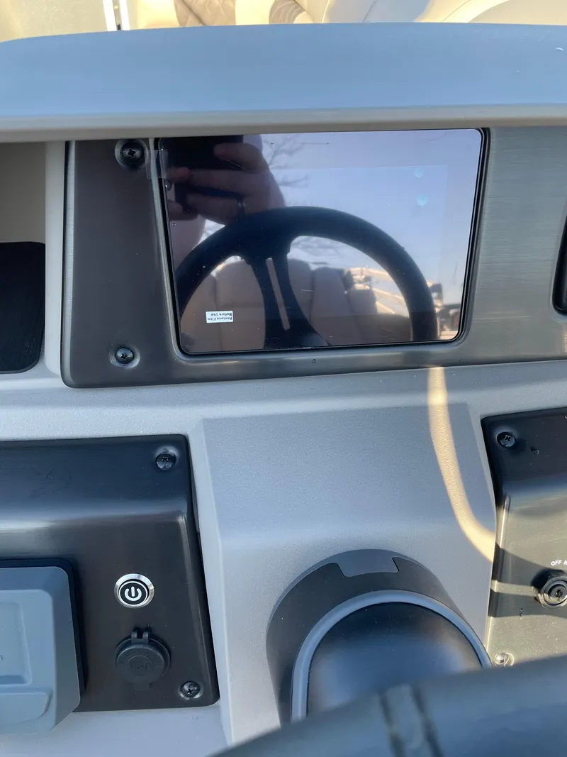 Slide: The Image of 2024 Sun Tracker Party Barge 22 RF DLX dashboard with touchscreen display. - 2