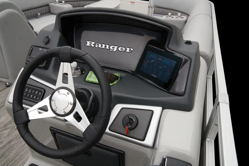Slide: The Image of 2024 Ranger Reata 243C boat with open storage compartments showing life jackets and accessories. - 37