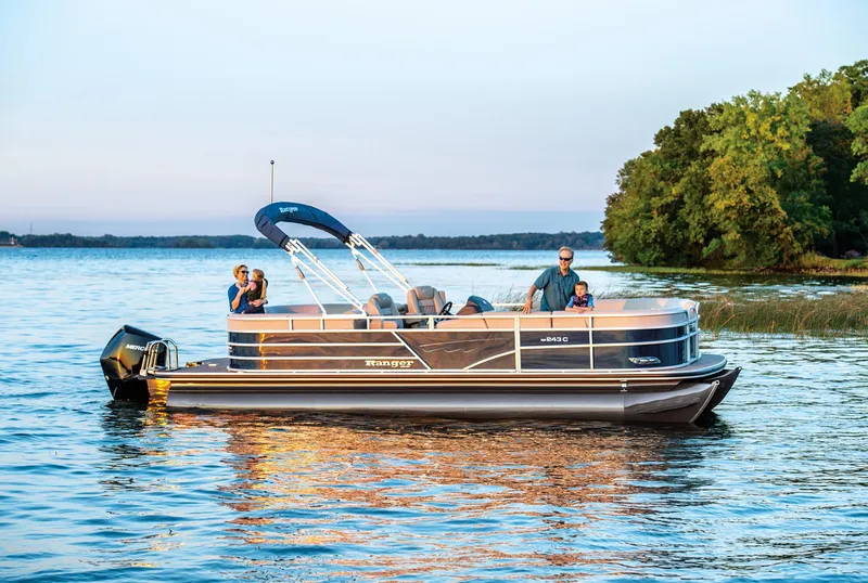 Slide: The Image of Throttle control of 2024 Ranger Reata 243C boat with capacity and safety labels. - 59