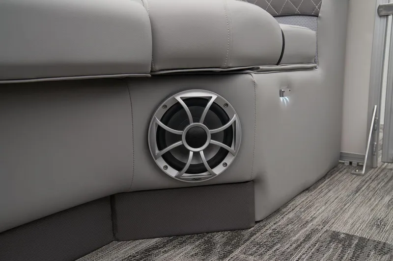 Slide: The Image of 2024 Ranger Reata 243C boat interior speaker and seating detail. - 61