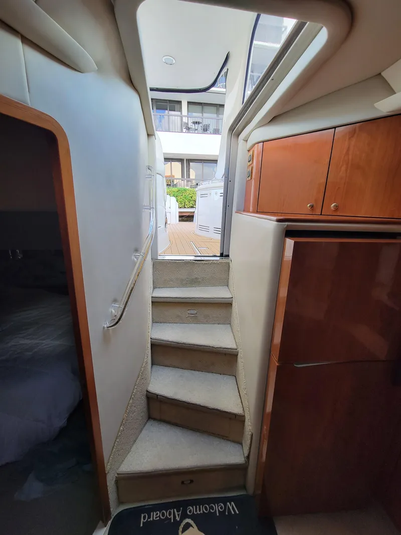 Slide: The Image of Interior stairs of a 2000 Sea Ray 540 Sundancer yacht leading to the deck. - 25