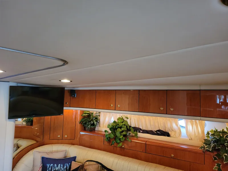 Slide: The Image of Interior of 2000 Sea Ray 540 Sundancer with wood cabinets and TV. - 43